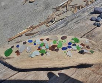 Drifting....my treasures after a morning at Conneaut Beach in Ohio. Found many pieces and some nice driftwood to display it on.