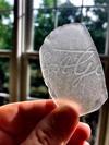 Script on sea glass