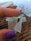 Identity, value or worth and any history on sea glass I'm holding that says something.