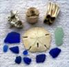 Pieces of blue sea glass, a piece of coral, ceramic insulator, teeth & piece of Coke bottle