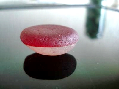 Red and white layered sea glass
