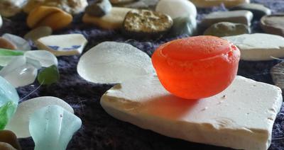 My most Unique Beach Glass Find - Unknown Orange Half Sphere