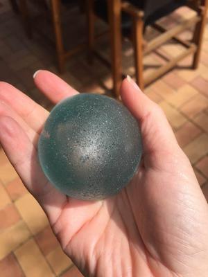 Egg-shaped cylinder of sea glass