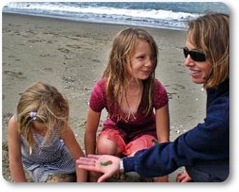 Claudia showing Kiley and Adrianna the Sea Glass