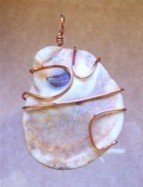 Shell wire wrapped in copper pendant
