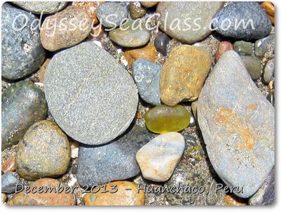 Unusual citron sea glass hiding under rocks - but didn't hide itself enough!