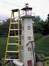 home made 8ft beach glass lighthouse