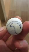 Round marble with thin blue swirls